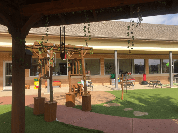 Wooden-Canopies-draped-with-flowers-in-alpha-montessori-school-plano